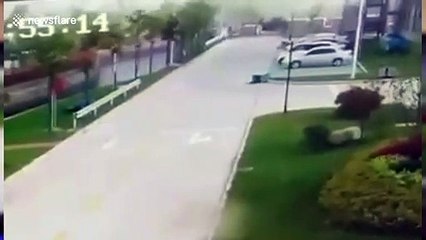 Powerful winds rip off building roof and push car into river in China