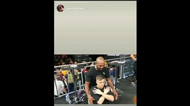 Jon Bones Jones puts a fan to sleep via rear naked choke.
