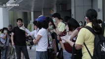 Sombre scenes from Bangkok shopping mall where fire killed two workers 'who stayed behind to fight flames'