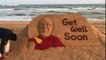 Sand artist in India carves 'Get Well' message for recently ill Dalai Lama