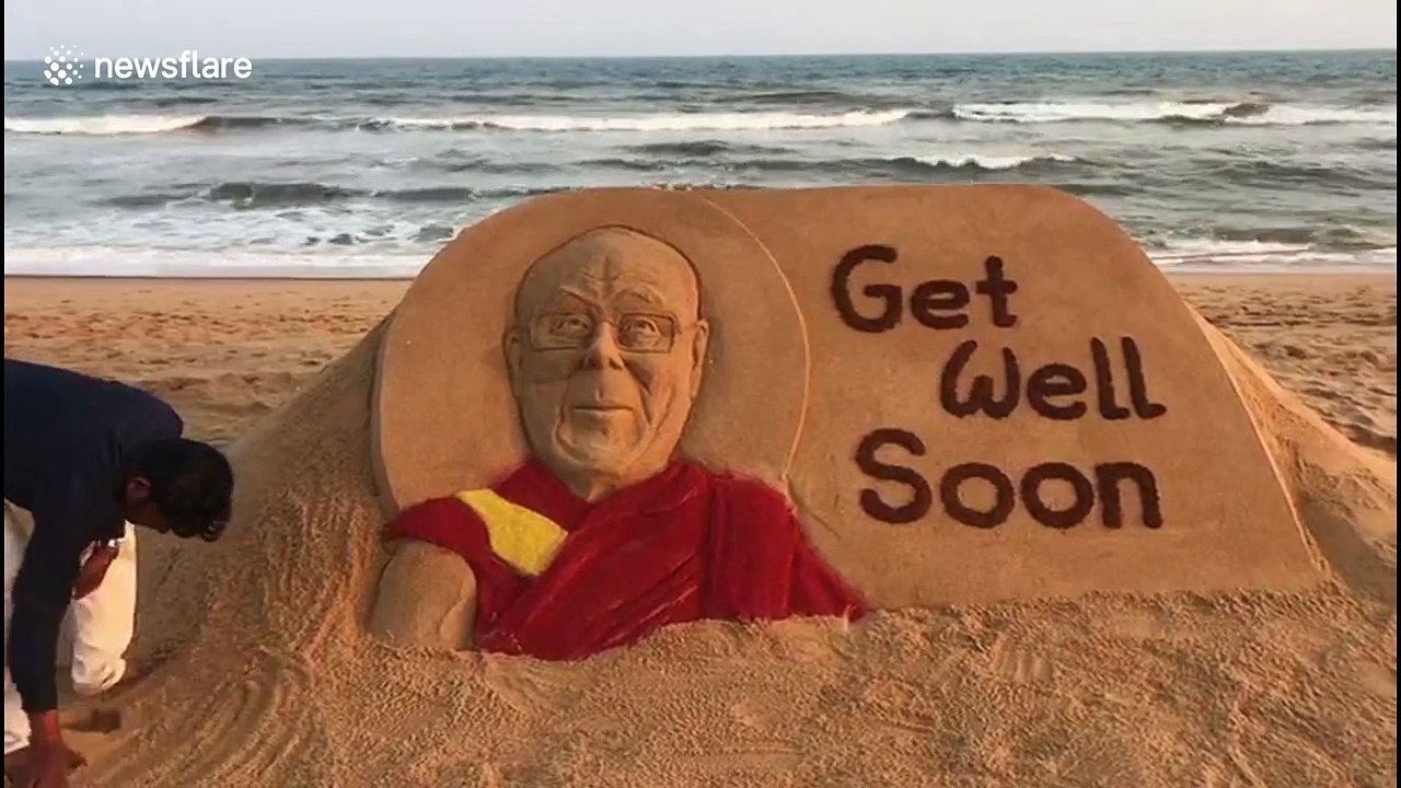 Sand artist in India carves 'Get Well' message for recently ill Dalai Lama