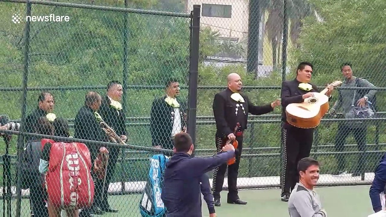 Tennis professional Ana Bogdan serenaded by Mariachi band during practice in Mexico