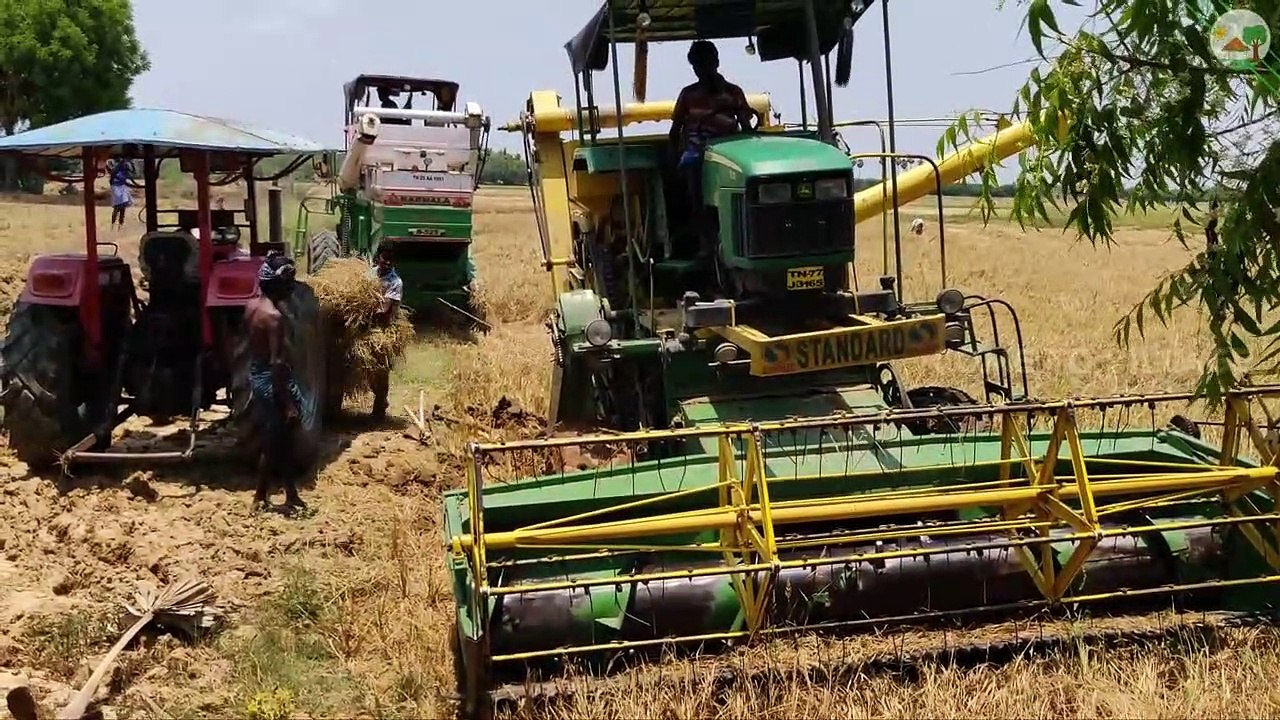 Mahindra harvester pulling John Deere harvester stuck in mud | Come to Village |