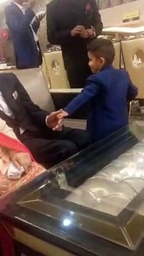 Cute boy asking his grandfather to play