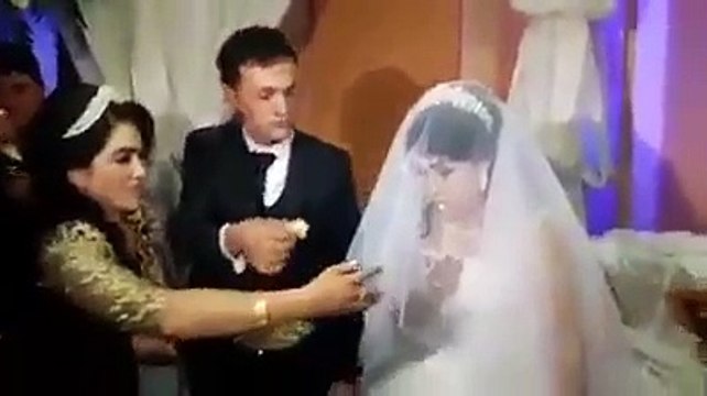 Husband slap wife on wedding cake cutting ceremony