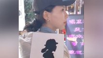 Chinese street artist cuts paper profiles in just one minute