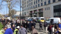 Climate change activists smash windows at Shell's London HQ