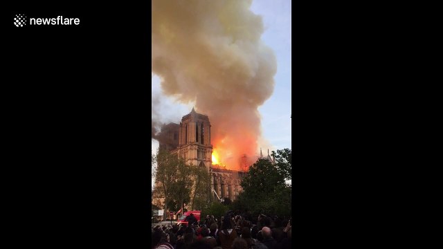 Crowd watches as flames engulf Notre Dame Cathedral in Paris