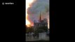 Moment Notre Dame's spire collapses during massive fire