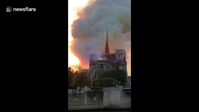 Moment Notre Dame's spire collapses during massive fire