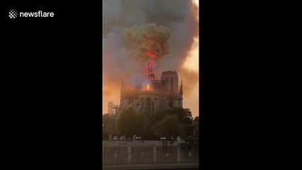 Shocking moment iconic Notre-Dame spire collapses into flames