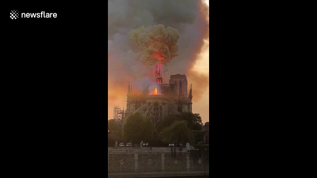 Shocking moment iconic Notre-Dame spire collapses into flames