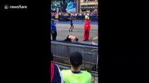 Marine running in honour of fallen comrades crawls to Boston Marathon finish line