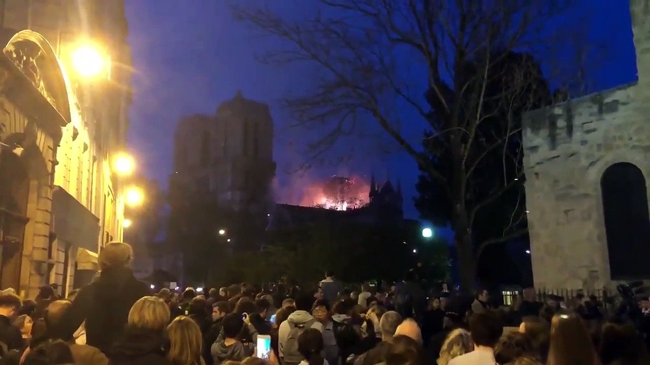 Crowd Sings Ave Maria as Notre Dame Burns