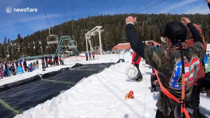 Snowboarder clears 60ft pond before somersaulting at California ski resort