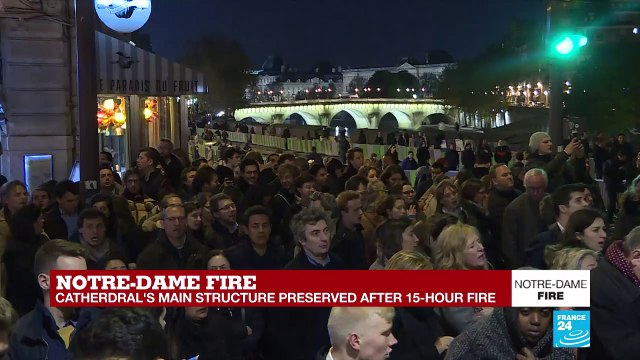 Notre-Dame fire: Parisians, tourists sing and pray for Cathedral