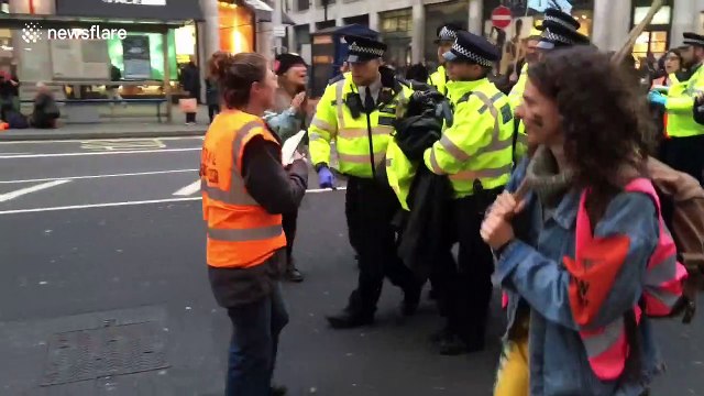 Extinction Rebellion activists carried away by police on second day of protests in London