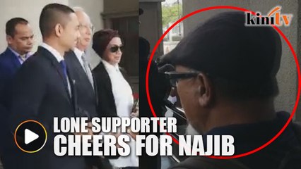 Lone supporter chants as Najib leaves court