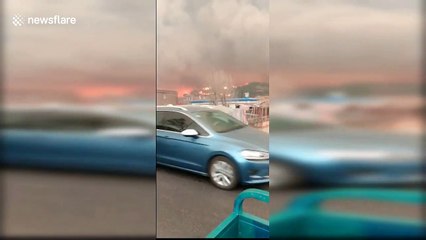 Major mountain fire sends mass of smoke all over Chinese city