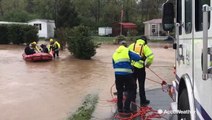 Stranded family rescued on boat from flash flooding