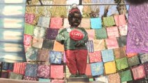 De Togo a Irak: refugiados llenan de arte los barrios de Bruselas