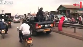 Stupid Ugandan Police drive-by Beating the Public