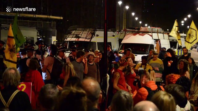 Extinction Rebellion protesters sing as arrests made at Parliament Square