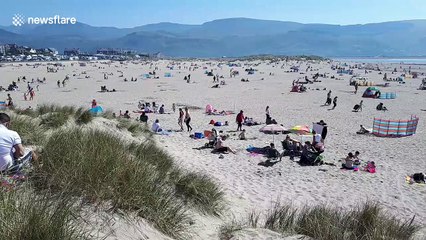 Hotter than Spain! Rare Easter heatwave packs Wales beach
