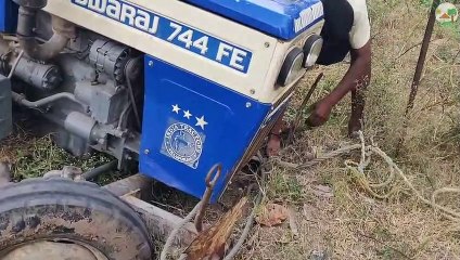 Swaraj 744 FE Tractor front wheel stuck with street drainage |