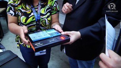 Comelec shows how to use its voter registration verification machine in May 13 elections