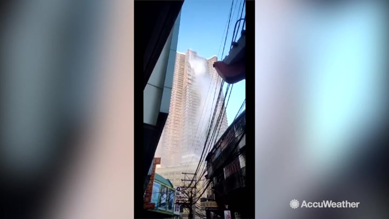Water cascades out of rooftop pool following major earthquake