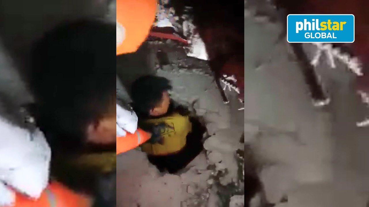 Rescuers help survivors out of Pampanga building collapsed by strong quake