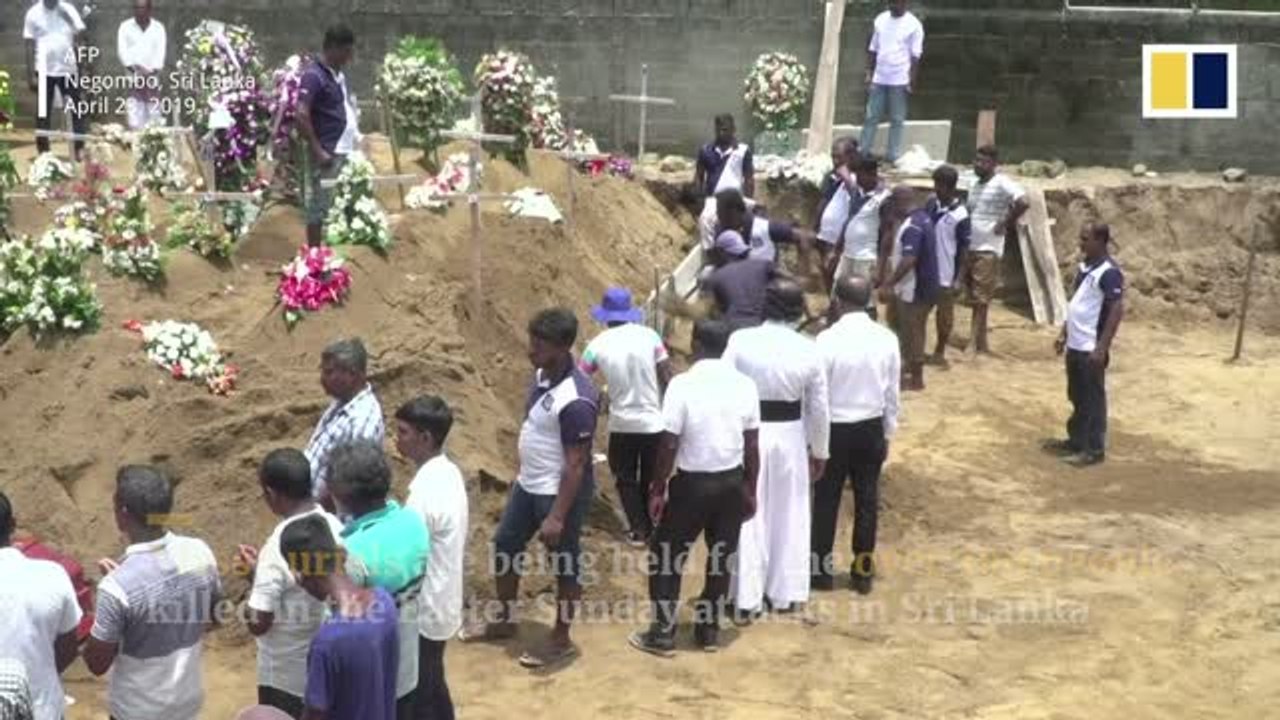 Mass funerals held for victims of Sri Lankan Easter Sunday bomb attacks as government admits intelligence failures
