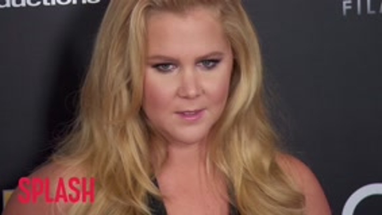 Amy Schumer Confirms She Is 'Still Pregnant And Puking'