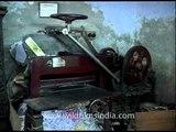 An ancient book binding machine in use in India!