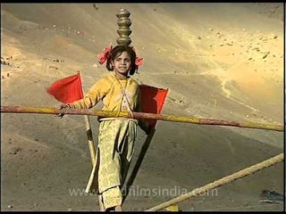 Kid performs dangerous tight rope walk, in the Himalaya