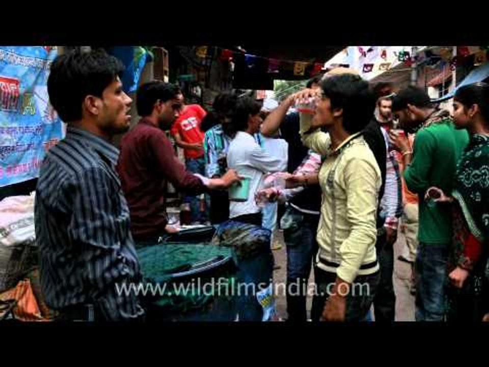 Visitors enjoying local soft drinks near south gate of Taj Mahal