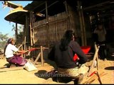 Lotha women weaving on back strap looms, Longsa village, Nagaland