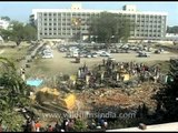 Bulldozers crush their houses as slum dwellers watch, India