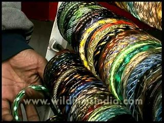 Colorful Indian bangles displayed in racks, Dillii Haat