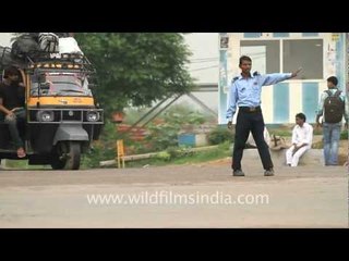 Private security guards regulate traffic here in Gurgaon - no traffic cops!