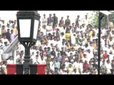 Jinnah's portrait with Pakistani crowd cheering for Flag down ceremony, Wagah border
