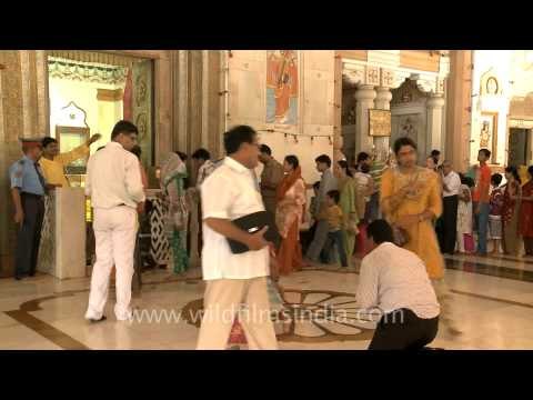 People arrive to celebrate Janmashtami at Birla Mandir in New Delhi