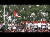 Indian crowd waves the tri colour flag at Wagah Border