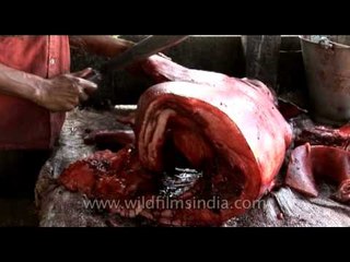 Pork sliced by a butcher in India
