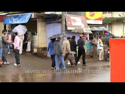 We met under an umbrella - old couples tour Panchgani market