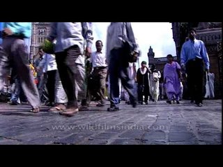 Mumbaikers crossing the street near Brihanmumbai Municipal Corporation