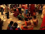 Devotees having prashad during Durga Puja