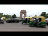 India Gate with green-yellow three-wheeler auto rickshaws
