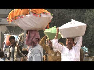 Offering prasad to the god of sun on Chatt Puja